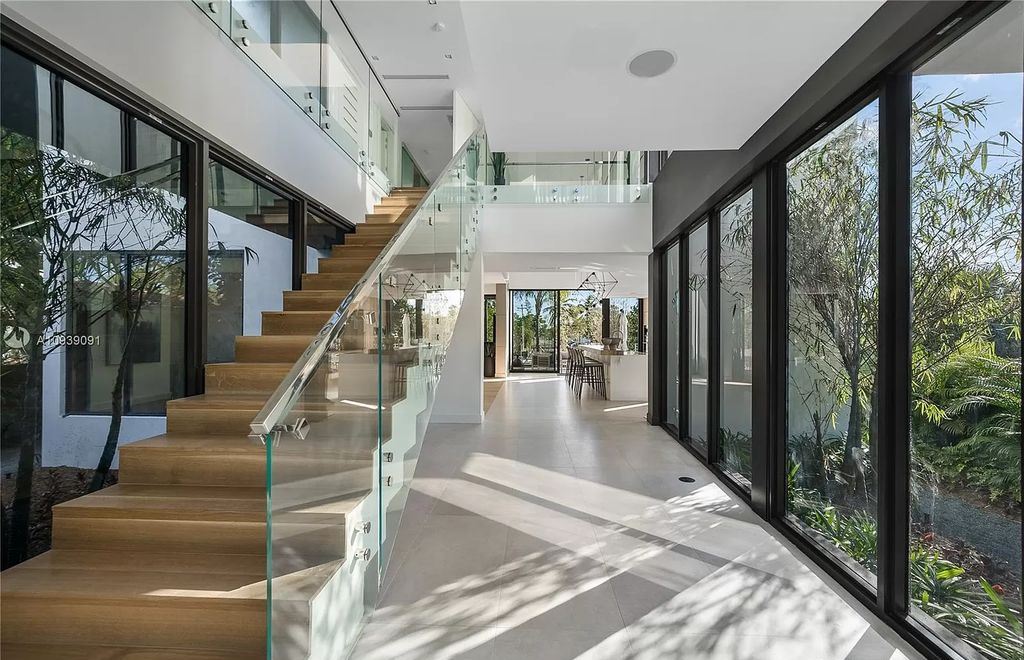 The Miami Beach Home is a new construction modern masterpiece located within the serene gated community of Normandy Isle now available for sale. This home located at 770 S Shore Dr, Miami Beach, Florida; offering 4 bedrooms and 5 bathrooms with over 5,000 square feet of living spaces.