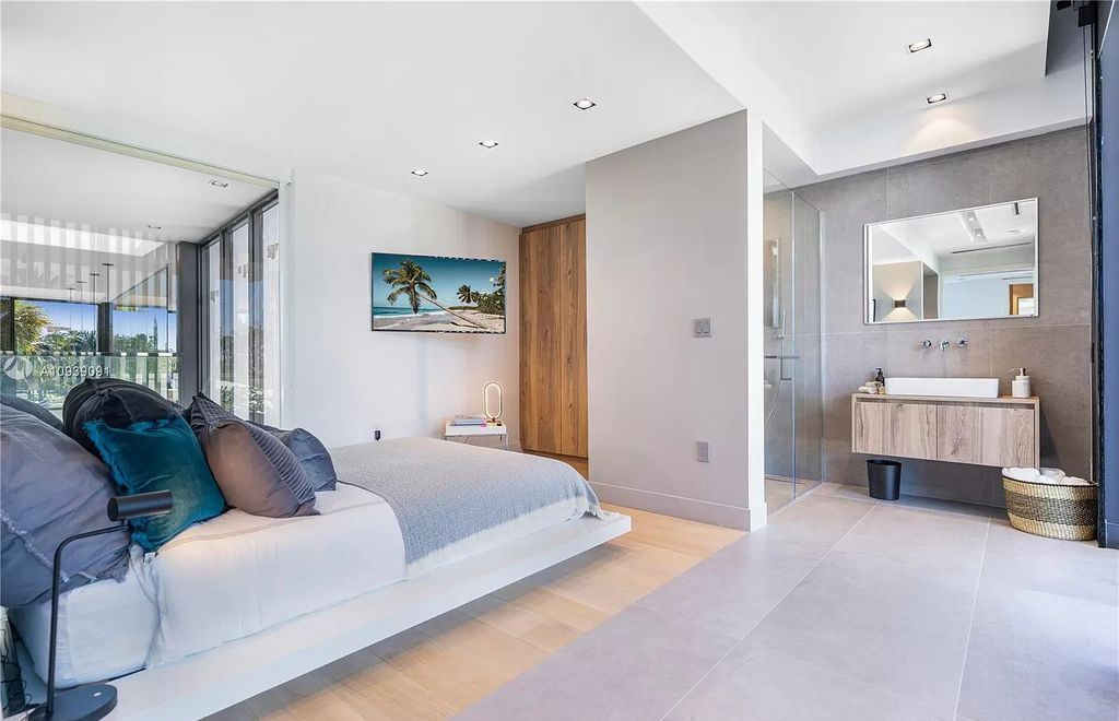 The Miami Beach Home is a new construction modern masterpiece located within the serene gated community of Normandy Isle now available for sale. This home located at 770 S Shore Dr, Miami Beach, Florida; offering 4 bedrooms and 5 bathrooms with over 5,000 square feet of living spaces.