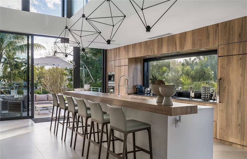 The Miami Beach Home is a new construction modern masterpiece located within the serene gated community of Normandy Isle now available for sale. This home located at 770 S Shore Dr, Miami Beach, Florida; offering 4 bedrooms and 5 bathrooms with over 5,000 square feet of living spaces.