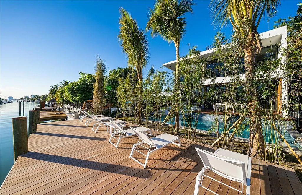 The Miami Beach Home is a new construction modern masterpiece located within the serene gated community of Normandy Isle now available for sale. This home located at 770 S Shore Dr, Miami Beach, Florida; offering 4 bedrooms and 5 bathrooms with over 5,000 square feet of living spaces.