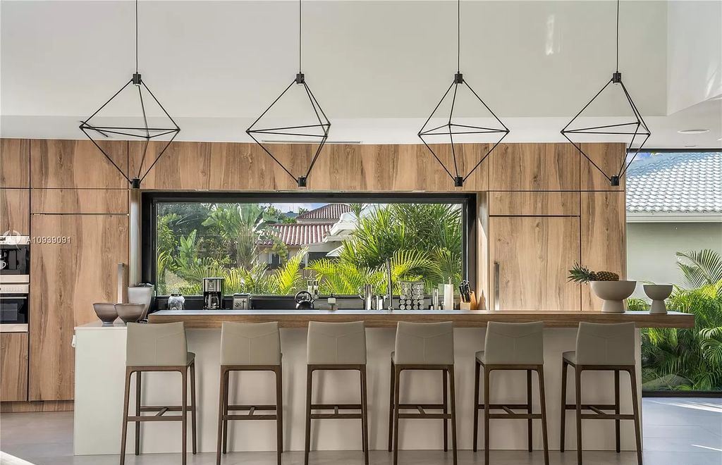 The Miami Beach Home is a new construction modern masterpiece located within the serene gated community of Normandy Isle now available for sale. This home located at 770 S Shore Dr, Miami Beach, Florida; offering 4 bedrooms and 5 bathrooms with over 5,000 square feet of living spaces.