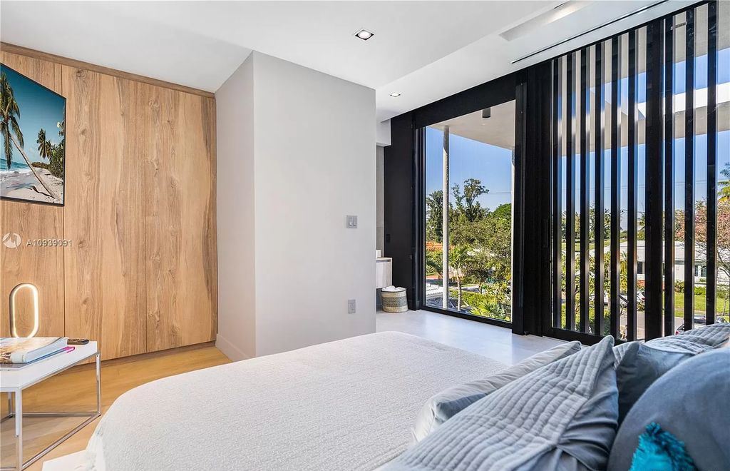 The Miami Beach Home is a new construction modern masterpiece located within the serene gated community of Normandy Isle now available for sale. This home located at 770 S Shore Dr, Miami Beach, Florida; offering 4 bedrooms and 5 bathrooms with over 5,000 square feet of living spaces.