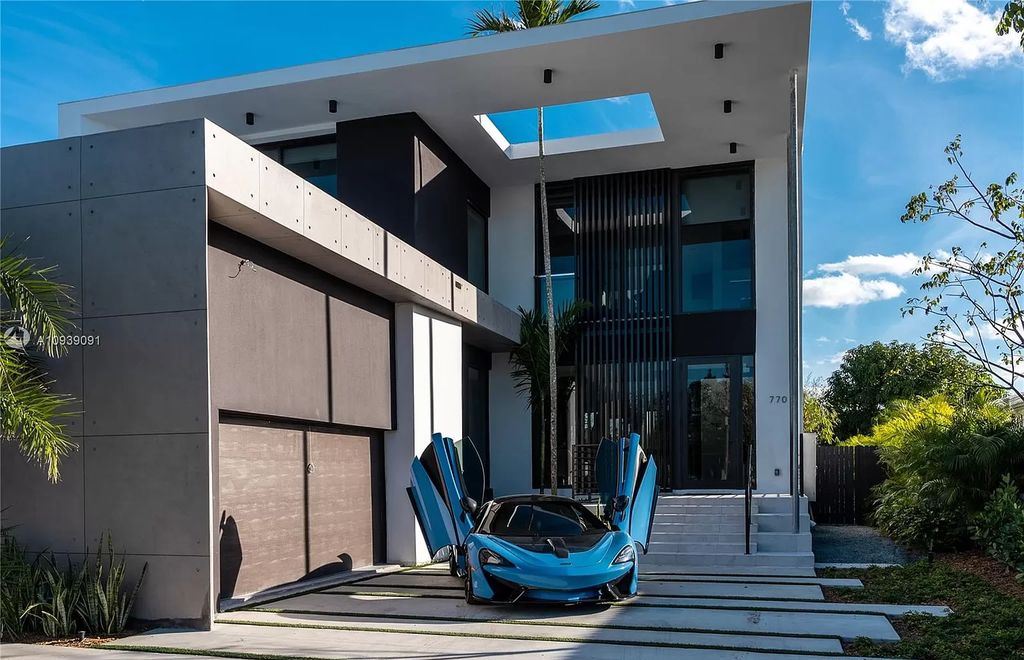 The Miami Beach Home is a new construction modern masterpiece located within the serene gated community of Normandy Isle now available for sale. This home located at 770 S Shore Dr, Miami Beach, Florida; offering 4 bedrooms and 5 bathrooms with over 5,000 square feet of living spaces.