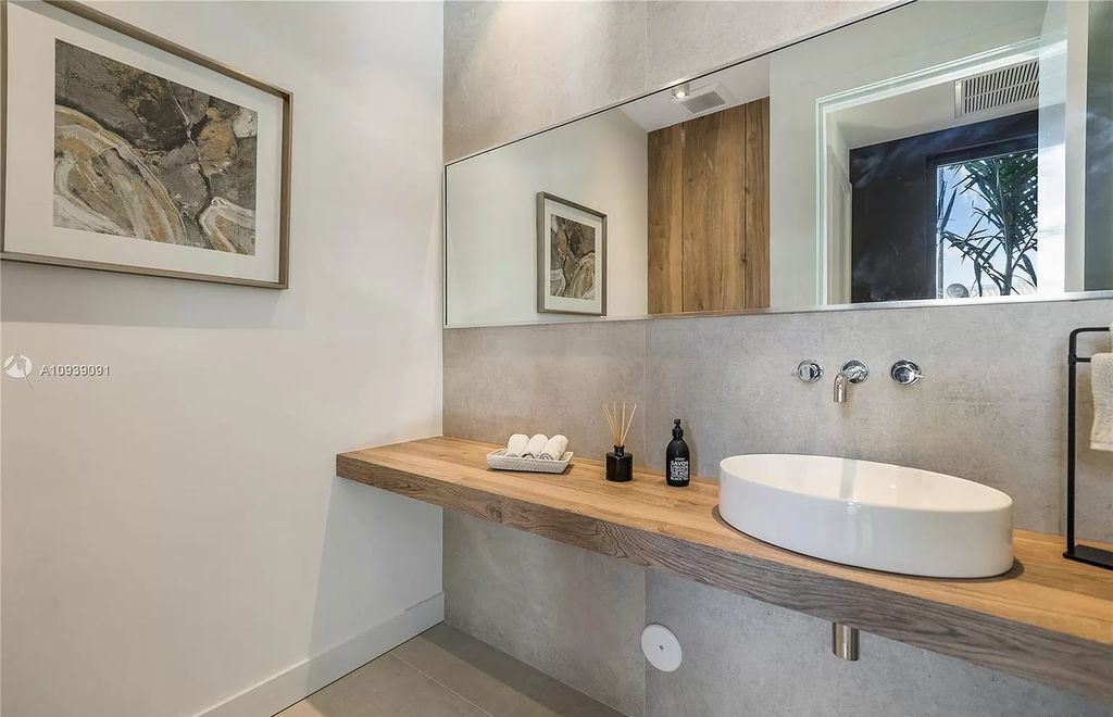 The Miami Beach Home is a new construction modern masterpiece located within the serene gated community of Normandy Isle now available for sale. This home located at 770 S Shore Dr, Miami Beach, Florida; offering 4 bedrooms and 5 bathrooms with over 5,000 square feet of living spaces.