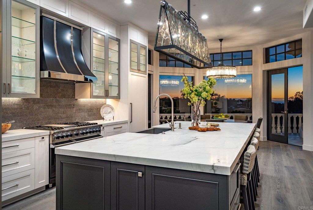 The Rancho Santa Fe Mediterranean Home is a luxurious property with breathtaking sunsets and panoramic views to the ocean now available for sale. This home located at 6823 Spyglass Ln, Rancho Santa Fe, California; offering 6 bedrooms and 7 bathrooms with over 7,300 square feet of living spaces.