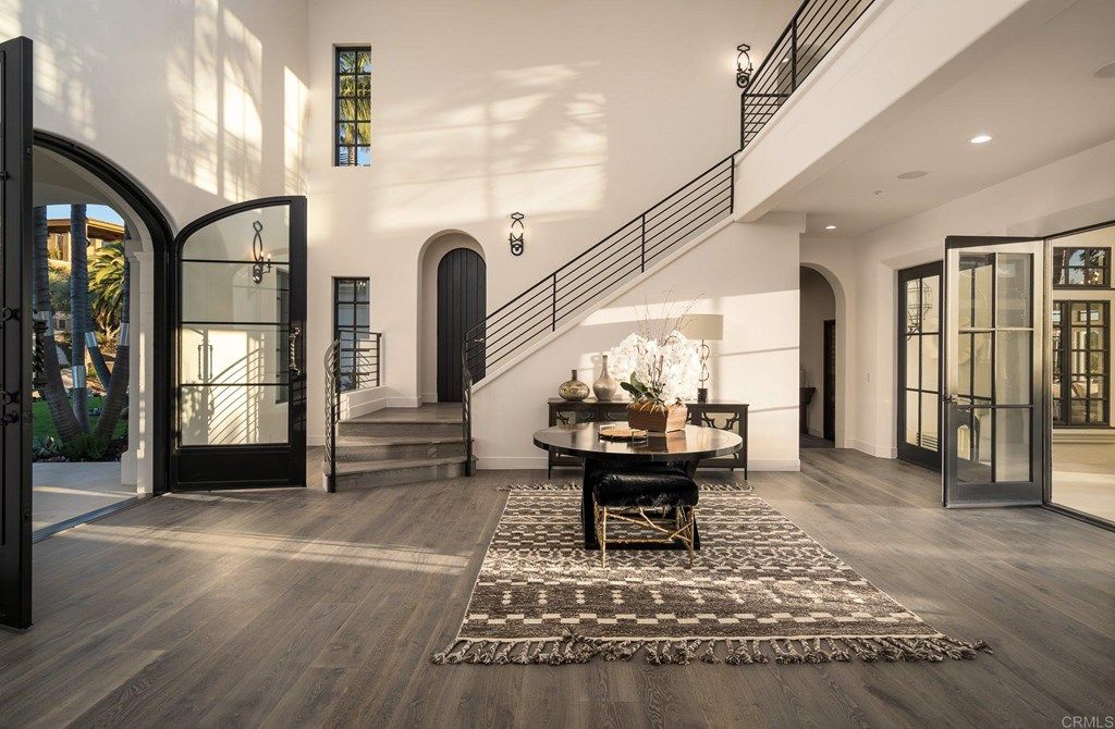 The Rancho Santa Fe Mediterranean Home is a luxurious property with breathtaking sunsets and panoramic views to the ocean now available for sale. This home located at 6823 Spyglass Ln, Rancho Santa Fe, California; offering 6 bedrooms and 7 bathrooms with over 7,300 square feet of living spaces.