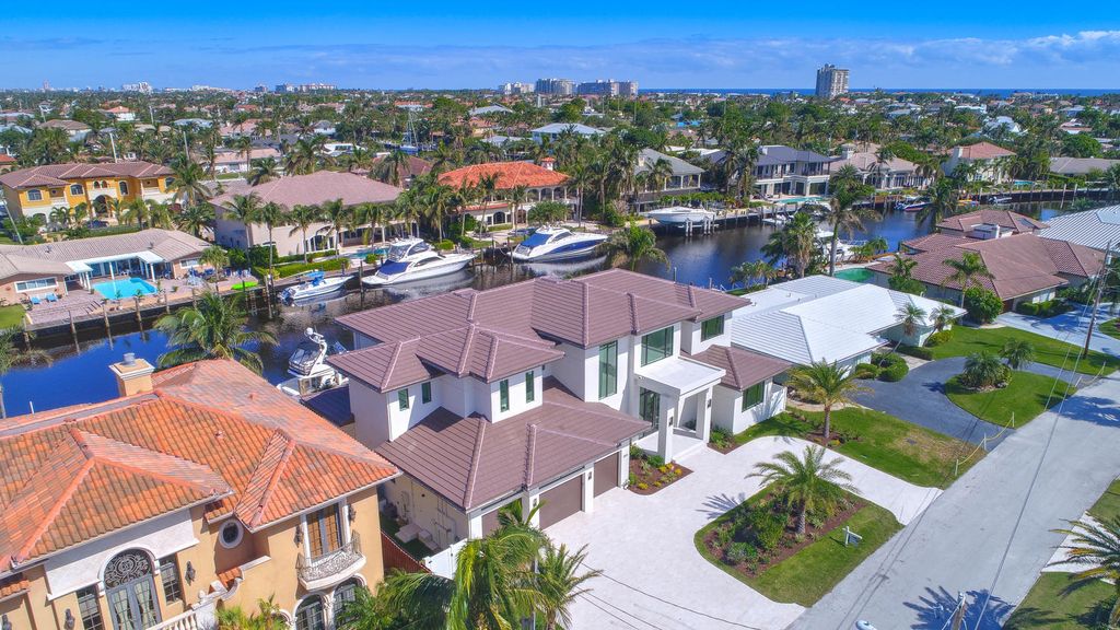 The Florida Waterfront Home is an exceptional estate with immaculate contemporary finishes designed by Zahn Builders now available for sale. This home located at 2431 NE 32nd Ct, Lighthouse Point, Florida; offering 5 bedrooms and 6 bathrooms with over 5,600 square feet of living spaces.