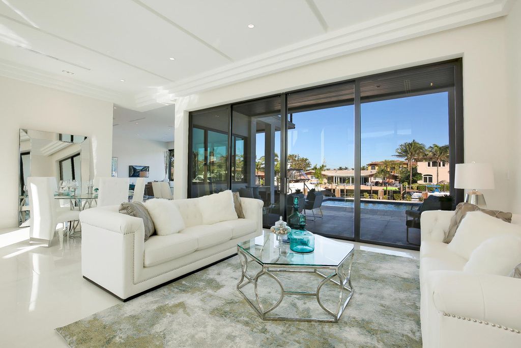 The Florida Waterfront Home is an exceptional estate with immaculate contemporary finishes designed by Zahn Builders now available for sale. This home located at 2431 NE 32nd Ct, Lighthouse Point, Florida; offering 5 bedrooms and 6 bathrooms with over 5,600 square feet of living spaces.
