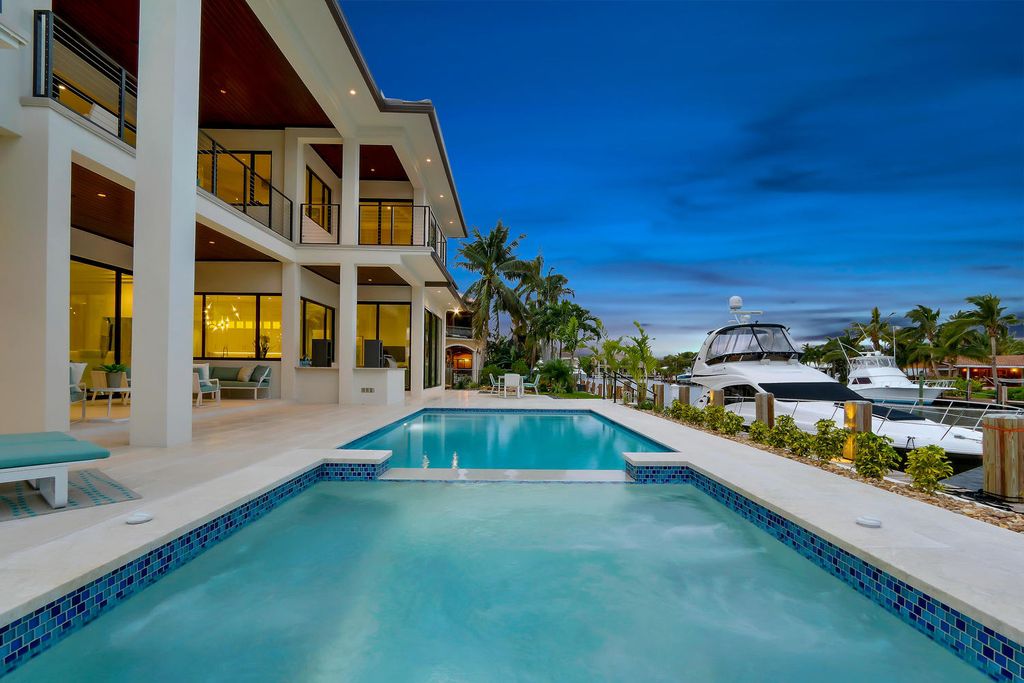 The Florida Waterfront Home is an exceptional estate with immaculate contemporary finishes designed by Zahn Builders now available for sale. This home located at 2431 NE 32nd Ct, Lighthouse Point, Florida; offering 5 bedrooms and 6 bathrooms with over 5,600 square feet of living spaces.