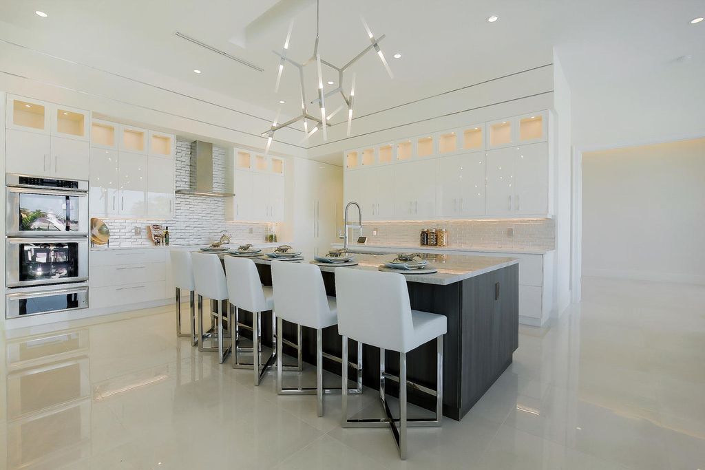 The Florida Waterfront Home is an exceptional estate with immaculate contemporary finishes designed by Zahn Builders now available for sale. This home located at 2431 NE 32nd Ct, Lighthouse Point, Florida; offering 5 bedrooms and 6 bathrooms with over 5,600 square feet of living spaces.