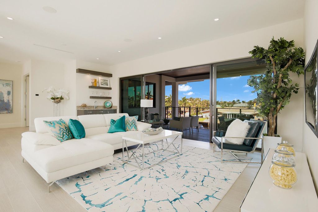 The Florida Waterfront Home is an exceptional estate with immaculate contemporary finishes designed by Zahn Builders now available for sale. This home located at 2431 NE 32nd Ct, Lighthouse Point, Florida; offering 5 bedrooms and 6 bathrooms with over 5,600 square feet of living spaces.