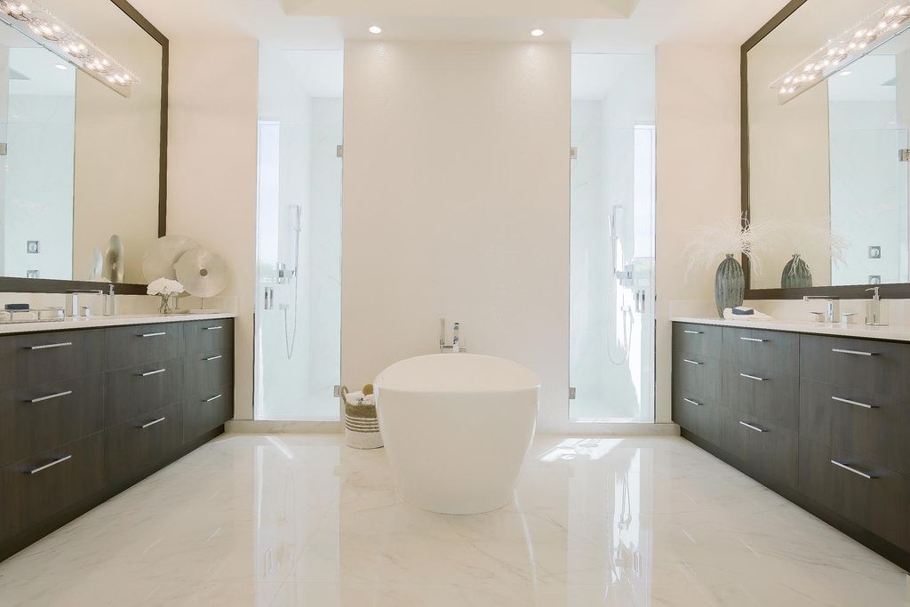 The Florida Waterfront Home is an exceptional estate with immaculate contemporary finishes designed by Zahn Builders now available for sale. This home located at 2431 NE 32nd Ct, Lighthouse Point, Florida; offering 5 bedrooms and 6 bathrooms with over 5,600 square feet of living spaces.