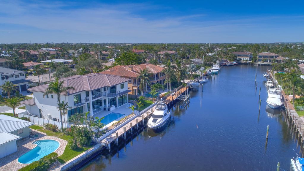 The Florida Waterfront Home is an exceptional estate with immaculate contemporary finishes designed by Zahn Builders now available for sale. This home located at 2431 NE 32nd Ct, Lighthouse Point, Florida; offering 5 bedrooms and 6 bathrooms with over 5,600 square feet of living spaces.