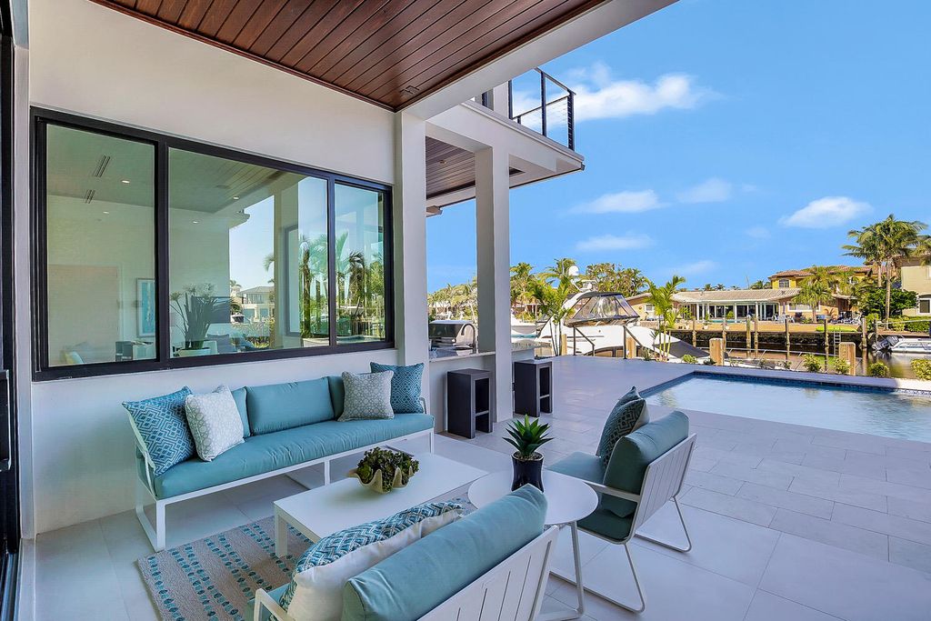 The Florida Waterfront Home is an exceptional estate with immaculate contemporary finishes designed by Zahn Builders now available for sale. This home located at 2431 NE 32nd Ct, Lighthouse Point, Florida; offering 5 bedrooms and 6 bathrooms with over 5,600 square feet of living spaces.