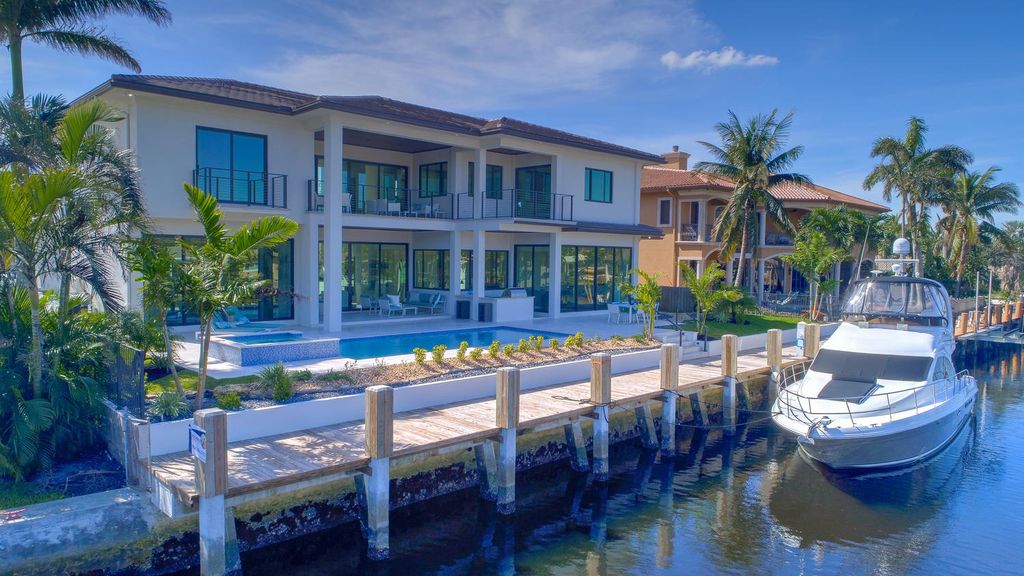 The Florida Waterfront Home is an exceptional estate with immaculate contemporary finishes designed by Zahn Builders now available for sale. This home located at 2431 NE 32nd Ct, Lighthouse Point, Florida; offering 5 bedrooms and 6 bathrooms with over 5,600 square feet of living spaces.