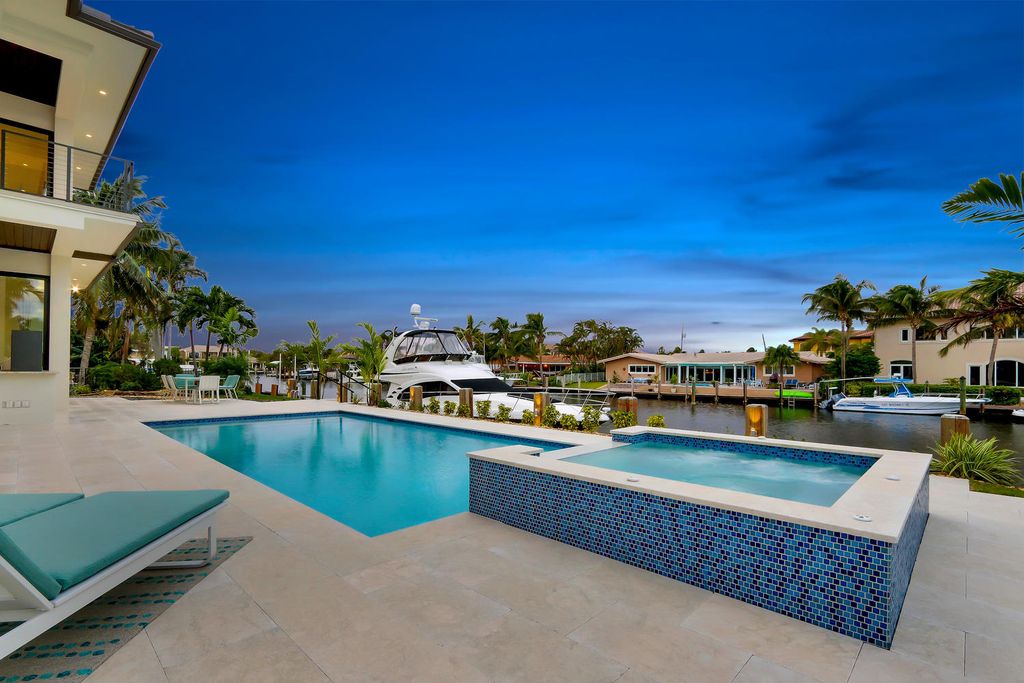 The Florida Waterfront Home is an exceptional estate with immaculate contemporary finishes designed by Zahn Builders now available for sale. This home located at 2431 NE 32nd Ct, Lighthouse Point, Florida; offering 5 bedrooms and 6 bathrooms with over 5,600 square feet of living spaces.