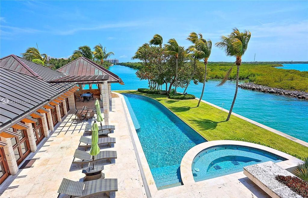 The Miami Waterfront Home is an outstanding residence offers total privacy and stunning water views with oversized pool now available for sale. This home located at 400 S Mashta Dr, Key Biscayne, Florida; offering 6 bedrooms and 7 bathrooms with over 8,200 square feet of living spaces