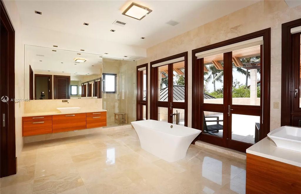 The Miami Waterfront Home is an outstanding residence offers total privacy and stunning water views with oversized pool now available for sale. This home located at 400 S Mashta Dr, Key Biscayne, Florida; offering 6 bedrooms and 7 bathrooms with over 8,200 square feet of living spaces