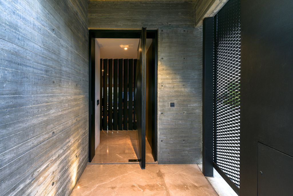 Concrete House in Cyprus was designed by Markella Menikou Chartered Architect in contemporary style with seamless extension to the outside; this house offers modern living with high end finishes and smart amenities. 