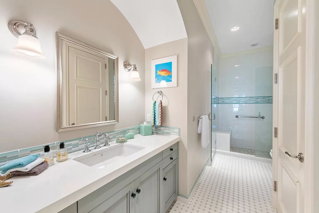 The Waterfront Estate is a Bermuda-Colonial style home has endless wide-water views of the St. Lucie River and Inlet now available for sale. This home located at 3015 SE Saint Lucie Blvd, Stuart, Florida; offering 4 bedrooms and 7 bathrooms with over 7,700 square feet of living spaces.