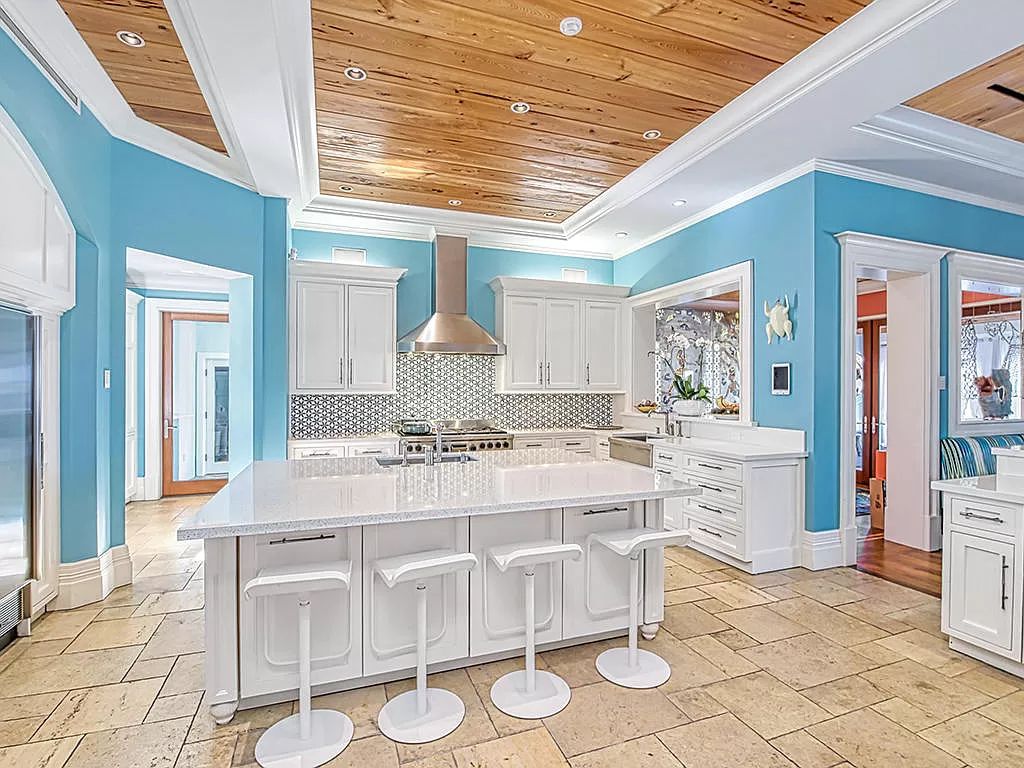 The Waterfront Estate is a Bermuda-Colonial style home has endless wide-water views of the St. Lucie River and Inlet now available for sale. This home located at 3015 SE Saint Lucie Blvd, Stuart, Florida; offering 4 bedrooms and 7 bathrooms with over 7,700 square feet of living spaces.