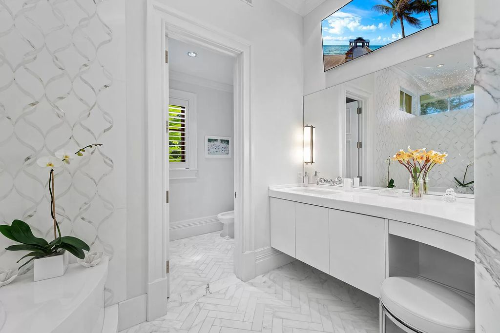 The Waterfront Estate is a Bermuda-Colonial style home has endless wide-water views of the St. Lucie River and Inlet now available for sale. This home located at 3015 SE Saint Lucie Blvd, Stuart, Florida; offering 4 bedrooms and 7 bathrooms with over 7,700 square feet of living spaces.