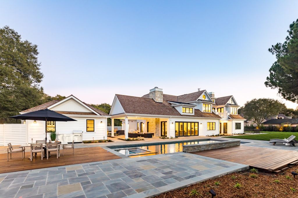 The House in Atherton is a grand estate offers the ultimate in high-end luxury while providing an unmatched living experience now available for sale. This home located at 55 Irving Ave, Atherton, California; offering 8 bedrooms and 11 bathrooms with over 10,500 square feet of living spaces.