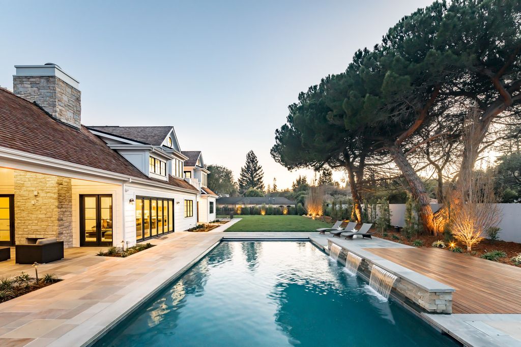 The House in Atherton is a grand estate offers the ultimate in high-end luxury while providing an unmatched living experience now available for sale. This home located at 55 Irving Ave, Atherton, California; offering 8 bedrooms and 11 bathrooms with over 10,500 square feet of living spaces.