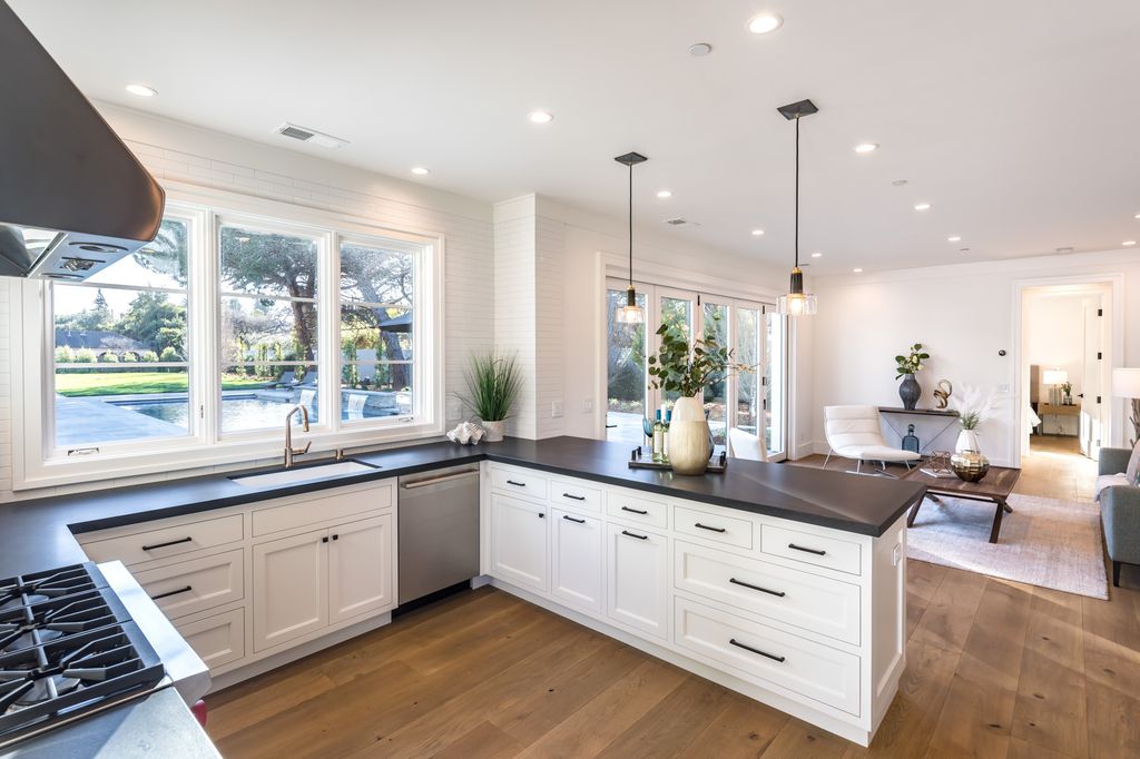 The House in Atherton is a grand estate offers the ultimate in high-end luxury while providing an unmatched living experience now available for sale. This home located at 55 Irving Ave, Atherton, California; offering 8 bedrooms and 11 bathrooms with over 10,500 square feet of living spaces.