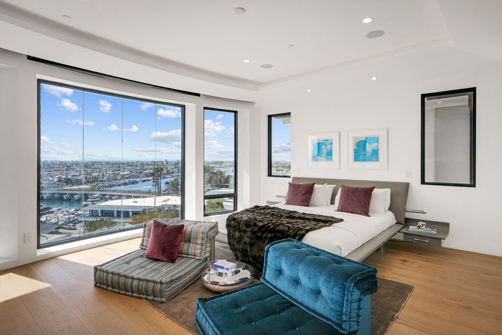 The California Contemporary Home is a luxuriously newly constructed residence with panoramic vistas of Newport Harbor now available for sale. This home located at 1215 Dolphin Ter, Corona Del Mar, California; offering 6 bedrooms and 8 bathrooms with over 7,200 square feet of living spaces.