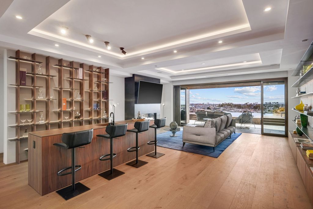The California Contemporary Home is a luxuriously newly constructed residence with panoramic vistas of Newport Harbor now available for sale. This home located at 1215 Dolphin Ter, Corona Del Mar, California; offering 6 bedrooms and 8 bathrooms with over 7,200 square feet of living spaces.