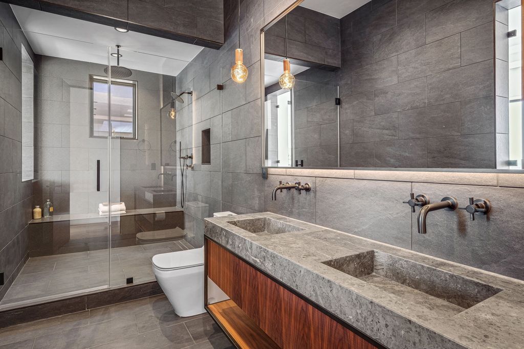 The California Contemporary Home is a luxuriously newly constructed residence with panoramic vistas of Newport Harbor now available for sale. This home located at 1215 Dolphin Ter, Corona Del Mar, California; offering 6 bedrooms and 8 bathrooms with over 7,200 square feet of living spaces.
