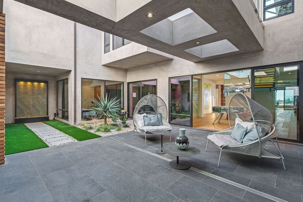 The California Contemporary Home is a luxuriously newly constructed residence with panoramic vistas of Newport Harbor now available for sale. This home located at 1215 Dolphin Ter, Corona Del Mar, California; offering 6 bedrooms and 8 bathrooms with over 7,200 square feet of living spaces.
