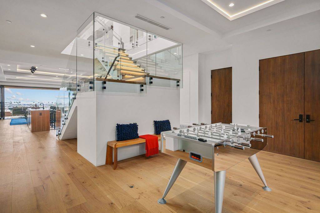 The California Contemporary Home is a luxuriously newly constructed residence with panoramic vistas of Newport Harbor now available for sale. This home located at 1215 Dolphin Ter, Corona Del Mar, California; offering 6 bedrooms and 8 bathrooms with over 7,200 square feet of living spaces.