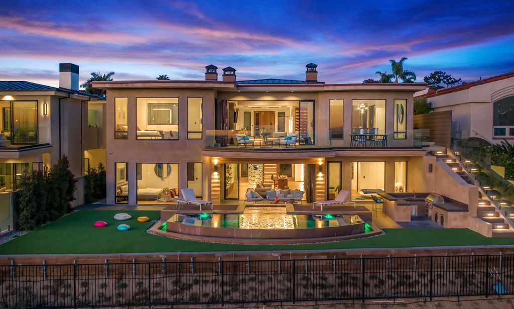 The California Contemporary Home is a luxuriously newly constructed residence with panoramic vistas of Newport Harbor now available for sale. This home located at 1215 Dolphin Ter, Corona Del Mar, California; offering 6 bedrooms and 8 bathrooms with over 7,200 square feet of living spaces.