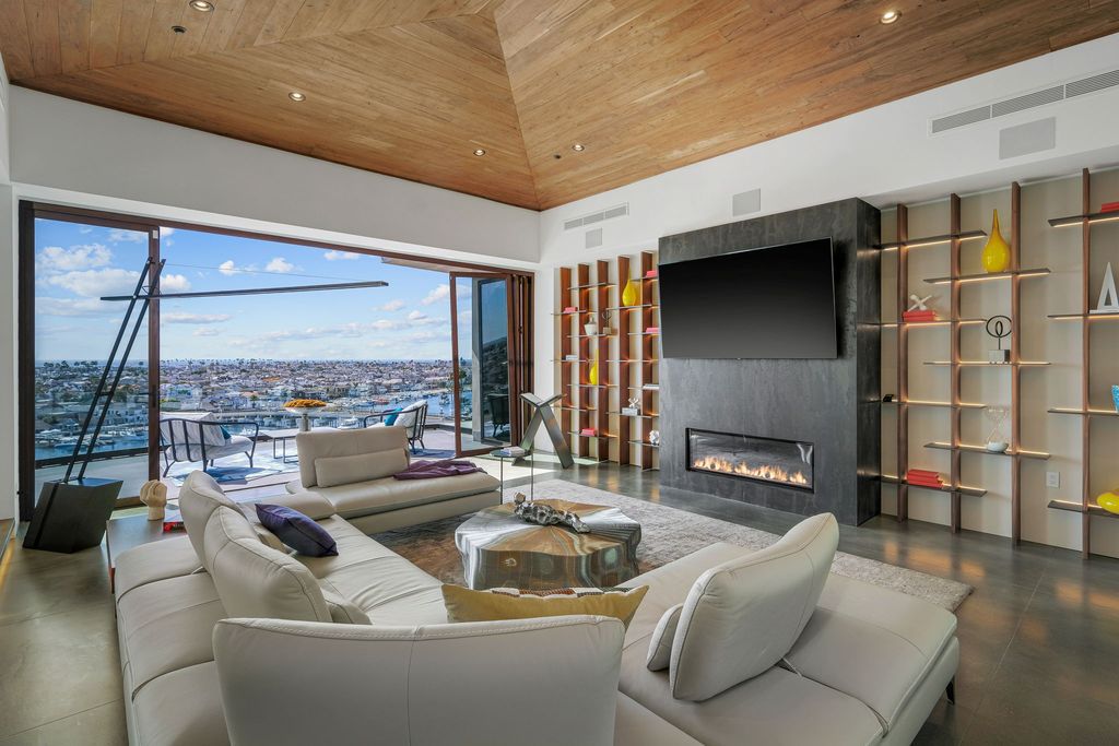 The California Contemporary Home is a luxuriously newly constructed residence with panoramic vistas of Newport Harbor now available for sale. This home located at 1215 Dolphin Ter, Corona Del Mar, California; offering 6 bedrooms and 8 bathrooms with over 7,200 square feet of living spaces.