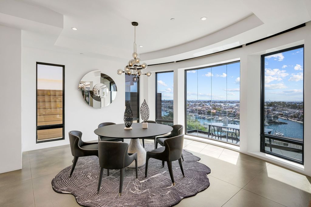 The California Contemporary Home is a luxuriously newly constructed residence with panoramic vistas of Newport Harbor now available for sale. This home located at 1215 Dolphin Ter, Corona Del Mar, California; offering 6 bedrooms and 8 bathrooms with over 7,200 square feet of living spaces.