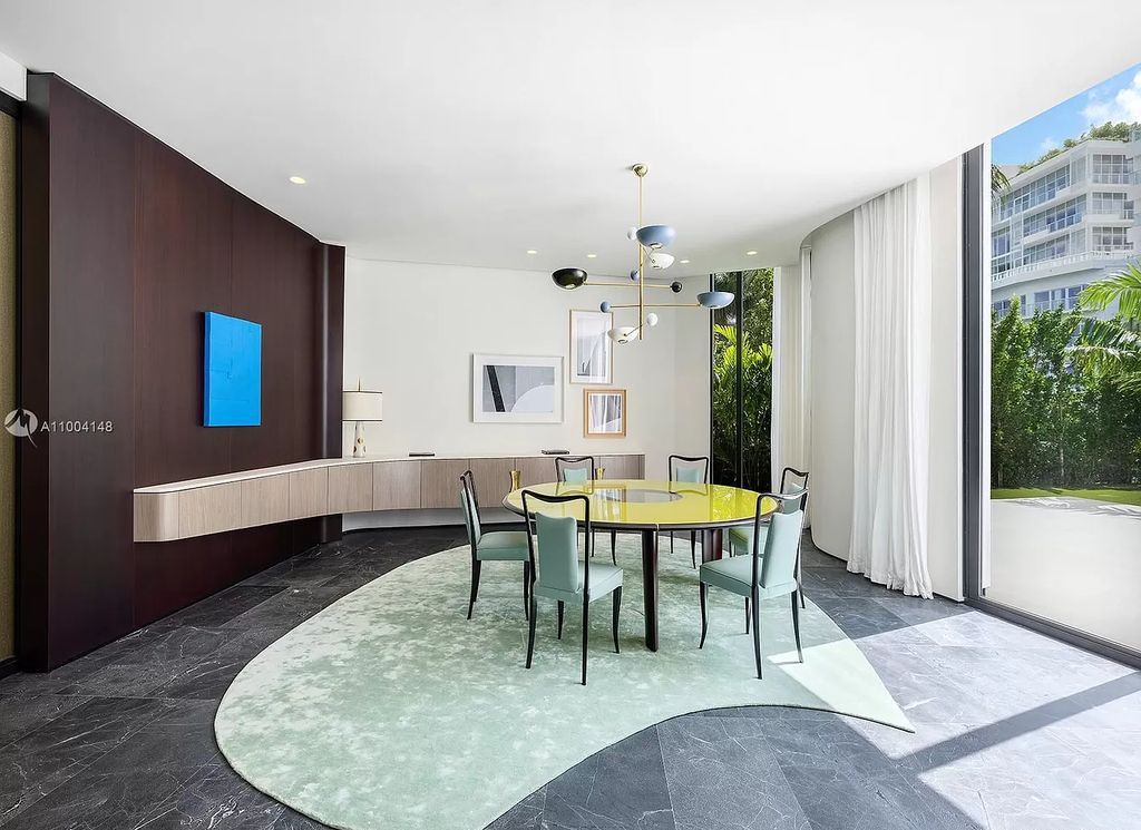 The Miami Beach Home is a new residence designed by world design star Achille Salvagni with a 90 ft infinity pool and private boat dock now available for sale. This home located at 810 Lakeview Dr, Miami Beach, Florida; offering 7 bedrooms and 7 bathrooms with over 7,900 square feet of living spaces.