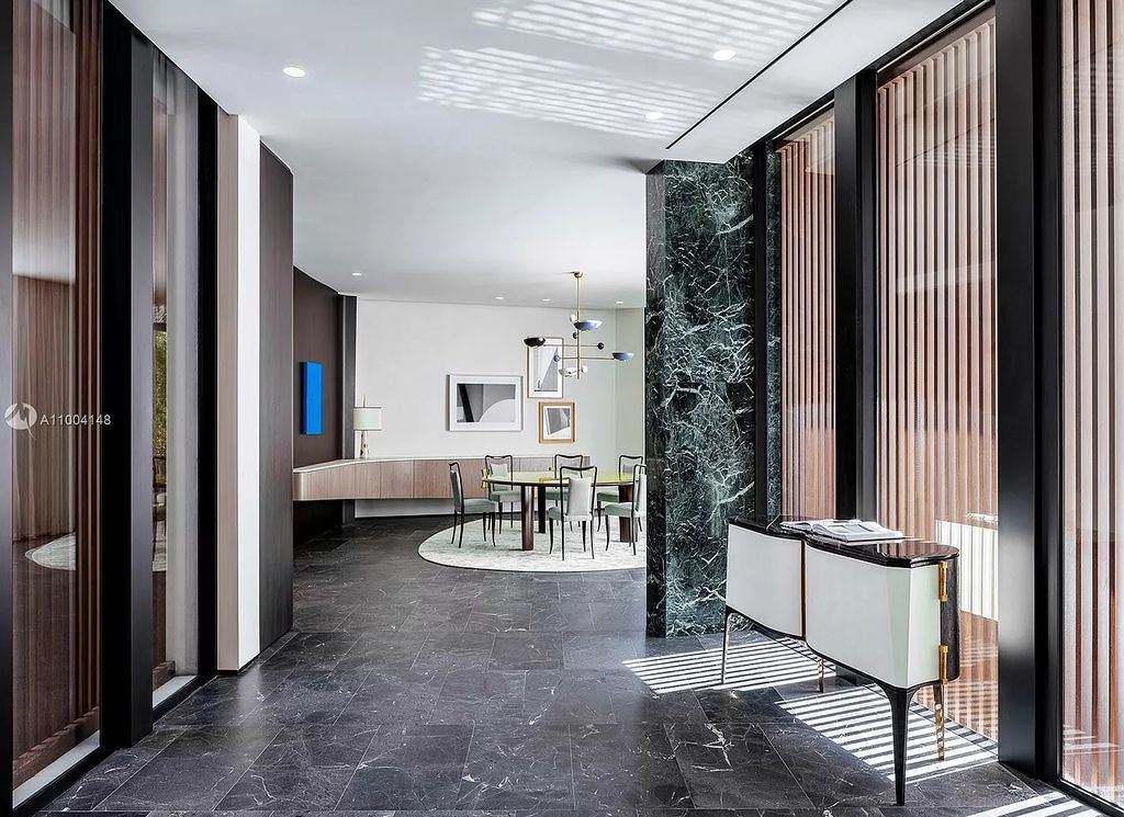 The Miami Beach Home is a new residence designed by world design star Achille Salvagni with a 90 ft infinity pool and private boat dock now available for sale. This home located at 810 Lakeview Dr, Miami Beach, Florida; offering 7 bedrooms and 7 bathrooms with over 7,900 square feet of living spaces.