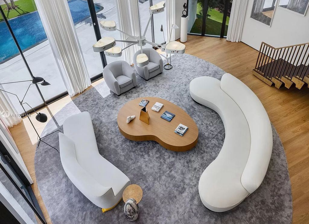 The Miami Beach Home is a new residence designed by world design star Achille Salvagni with a 90 ft infinity pool and private boat dock now available for sale. This home located at 810 Lakeview Dr, Miami Beach, Florida; offering 7 bedrooms and 7 bathrooms with over 7,900 square feet of living spaces.