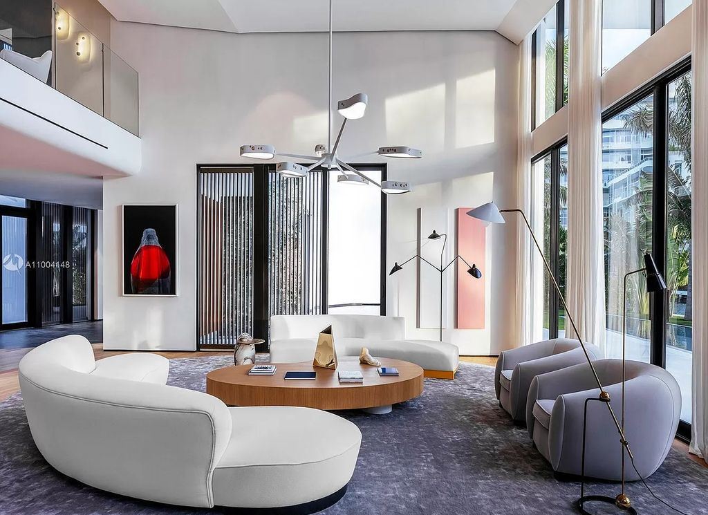 The Miami Beach Home is a new residence designed by world design star Achille Salvagni with a 90 ft infinity pool and private boat dock now available for sale. This home located at 810 Lakeview Dr, Miami Beach, Florida; offering 7 bedrooms and 7 bathrooms with over 7,900 square feet of living spaces.