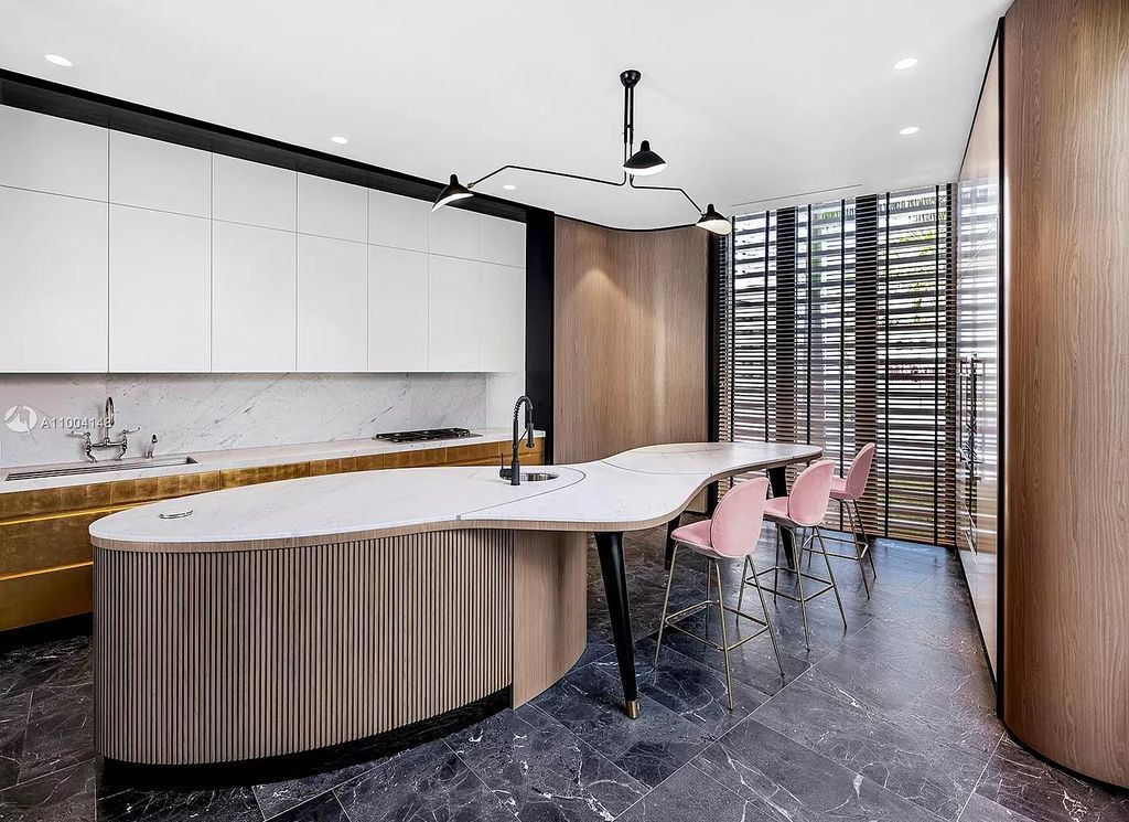 The Miami Beach Home is a new residence designed by world design star Achille Salvagni with a 90 ft infinity pool and private boat dock now available for sale. This home located at 810 Lakeview Dr, Miami Beach, Florida; offering 7 bedrooms and 7 bathrooms with over 7,900 square feet of living spaces.