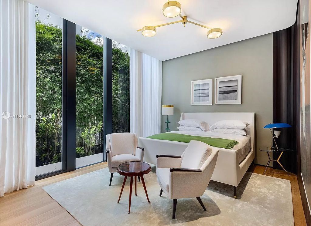 The Miami Beach Home is a new residence designed by world design star Achille Salvagni with a 90 ft infinity pool and private boat dock now available for sale. This home located at 810 Lakeview Dr, Miami Beach, Florida; offering 7 bedrooms and 7 bathrooms with over 7,900 square feet of living spaces.
