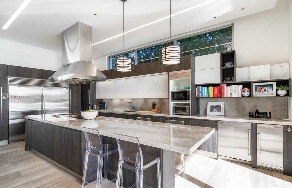 The Miami Beach Villa is a luxurious home perfect for entertaining with large manicured garden and full outdoor kitchen now available for sale. This home located at 1220 S Biscayne Point Rd, Miami Beach, Florida; offering 6 bedrooms and 6 bathrooms with over 5,400 square feet of living spaces.