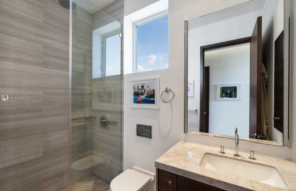 The Miami Beach Villa is a luxurious home perfect for entertaining with large manicured garden and full outdoor kitchen now available for sale. This home located at 1220 S Biscayne Point Rd, Miami Beach, Florida; offering 6 bedrooms and 6 bathrooms with over 5,400 square feet of living spaces.