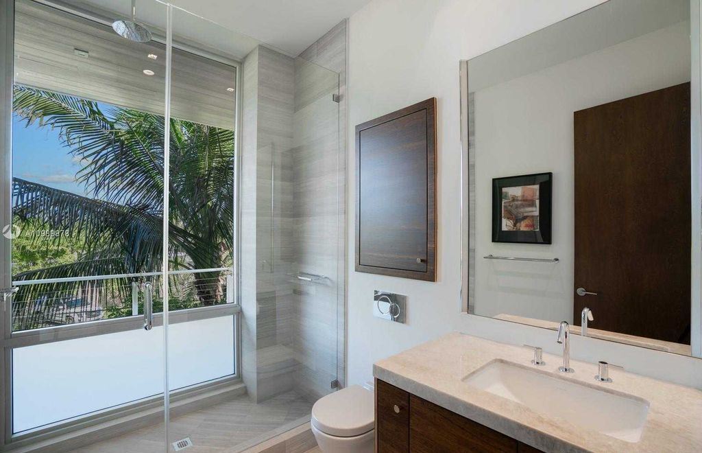 The Miami Beach Villa is a luxurious home perfect for entertaining with large manicured garden and full outdoor kitchen now available for sale. This home located at 1220 S Biscayne Point Rd, Miami Beach, Florida; offering 6 bedrooms and 6 bathrooms with over 5,400 square feet of living spaces.