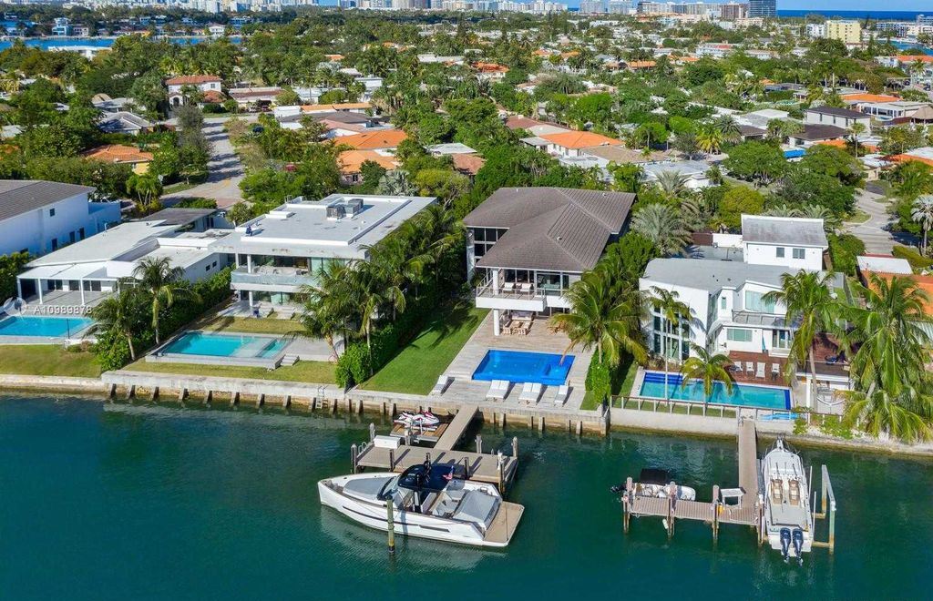 The Miami Beach Villa is a luxurious home perfect for entertaining with large manicured garden and full outdoor kitchen now available for sale. This home located at 1220 S Biscayne Point Rd, Miami Beach, Florida; offering 6 bedrooms and 6 bathrooms with over 5,400 square feet of living spaces.