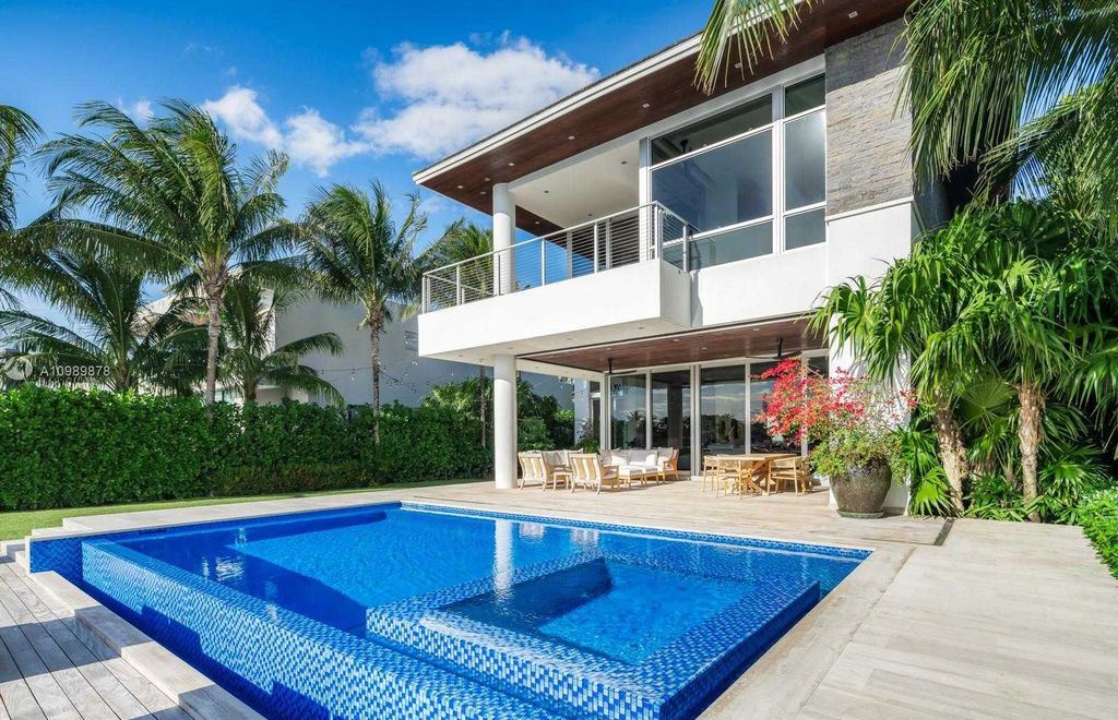 The Miami Beach Villa is a luxurious home perfect for entertaining with large manicured garden and full outdoor kitchen now available for sale. This home located at 1220 S Biscayne Point Rd, Miami Beach, Florida; offering 6 bedrooms and 6 bathrooms with over 5,400 square feet of living spaces.