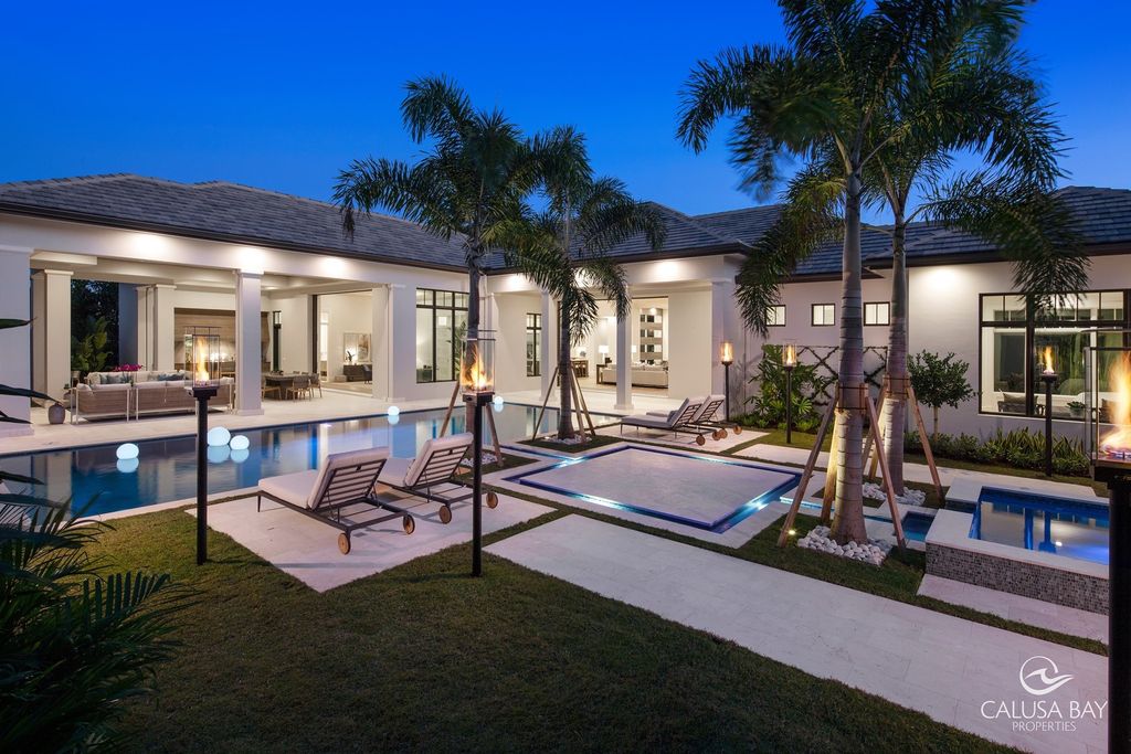 The Contemporary Home is perfectly complemented by lush mature tropical landscaping in the heart of Pelican Bay now available for sale. This home located at 810 Bentwood Dr, Naples, Florida; offering 4 bedrooms and 6 bathrooms with over 4,600 square feet of living spaces.