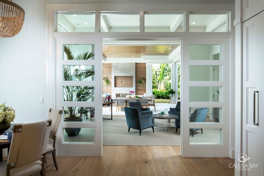 The Contemporary Home is perfectly complemented by lush mature tropical landscaping in the heart of Pelican Bay now available for sale. This home located at 810 Bentwood Dr, Naples, Florida; offering 4 bedrooms and 6 bathrooms with over 4,600 square feet of living spaces.